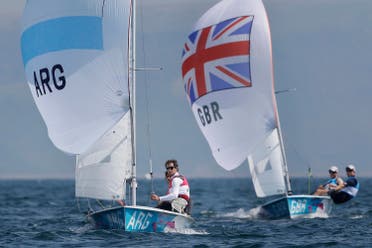 Argentina's Lucas Calabrese and Juan de la Fuente, foreground, and Great Britain's Luke Patience and Stuart Bithell compete during the 470 men's class medal race at the London 2012 Summer Olympics, Friday, Aug. 10, 2012, in Weymouth and Portland, England. Australia's Mathew Belcher and Malcolm Page won the gold medal, Great Britain's won the silver and Argentina's won the bronze. (AP)