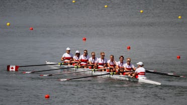 Team Canada row with their silver medals after the victory ceremony following the women's eight finals rowing event during the London 2012 Olympic Games at Eton Dorney August 2, 2012. (Reuters)