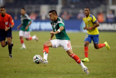 In his May 31, 2014 picture Mexico midfielder Marco Fabian controls the ball against Ecuador during a friendly soccer match in Arlington, Texas. Eintracht Frankfurt has signed Mexico midfielder Marco Fabian, the Bundesliga club says Thursday Dec. 24, 2015. The attacking midfielder signed a contract through mid-2019. Fabian last played for CD Cruz Azul on loan from Deportivo Guadalajara. He was on the Mexican team at the 2014 World Cup in Brazil and won gold with Mexico at the 2012 London Olympics. (AP)