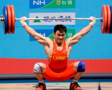 China's Liao Hui competes in the snatch during the men's group A 69-kilogram category of the World Weightlifting Championships in Goyang, west of Seoul, South Korea. (AP)