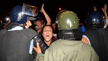 Relatives of boarders in a youth rehabilitation center adjoining the civil prison of Oukacha shout slogans after an attempted mass escape turned into riots in Casablanca on July 28, 2016. (AFP)