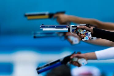 Competitors take aim in the combination running and shooting stage of the women's modern pentathlon, at the 2012 Summer Olympics, Sunday, Aug. 12, 2012, in London. (AP