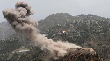FILE - In this May 21, 2015, photo, smoke rises from al-Qahira castle, an ancient fortress that was recently taken over by Shiite rebels, as another building on the Saber mountain, in the background, explodes after Saudi-led air strikes in Taiz city, Yemen. The the air campaign waged by the Saudi-led, U.S.-backed coalition in Yemen has been increasingly criticized by human rights activists over civilian deaths. Yet arms deals continue, especially from the U.S. (AP Photo/Abdulnasser Alseddik, File)