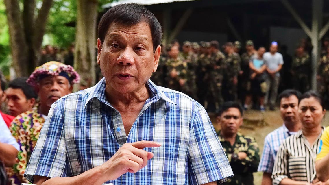 on July 30, 2016, Philippine President Rodrigo Duterte speaks to members of the media during a visit to a military camp in Asuncion town, Davao del Norte province. AFP