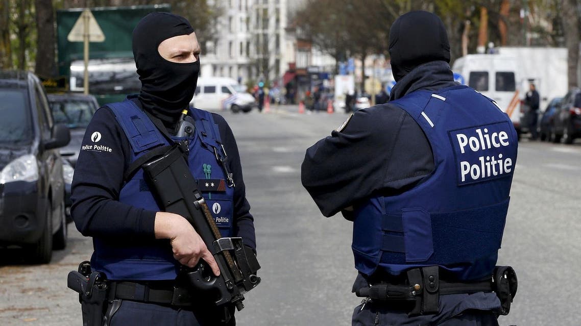 Belgium police officers secure the access during a police operation in Etterbeek, near Brussels, Belgium, April 9, 2016. REUTERS/Yves Herman TPX IMAGES OF THE DAY