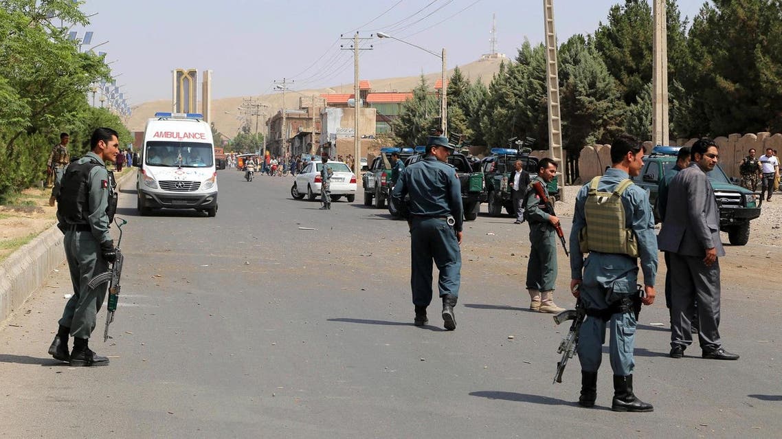 Afghan police soldiers inspect the site of a bomb attack, in Herat, Afghanistan, Saturday, July 30, 2016. (AP Photo/Hamed Sarfarazi)