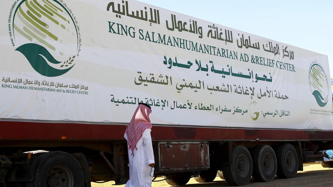 A saudi man walks next to a truck loaded with aid offered by King Salman Center for Relief and Humanitarian Aid to be sent to the Yemeni people, in Riyadh April 17, 2016. REUTERS