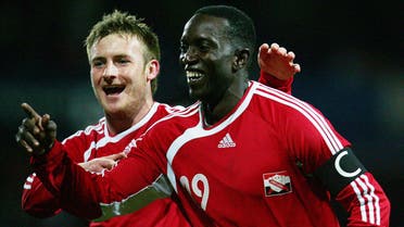 Trinidad and Tobago's Dwight Yorke (R) celebrates his goal with Chris Birchall during their international friendly soccer match against Iceland at Loftus Road, London, February 28, 2006. (Reuters)