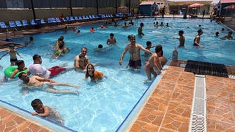 Iraqis take swimming to ward off searing heat 