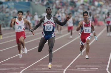 The USA’s Carl Lewis, center, Houston, Tex., hits the line ahead of Japan’s Tatsuo Sugimoto (left), and Cuba’s Jorge Luis Aguilera Ruiz, in the semi-final of the Men’s 4×100 meter relay at Barcelona’s Olympic Stadium, Friday, August 7, 1992. Each team qualified for the final with Lewis finishing first, Ruiz second and Sugimoto fourth. (AP)