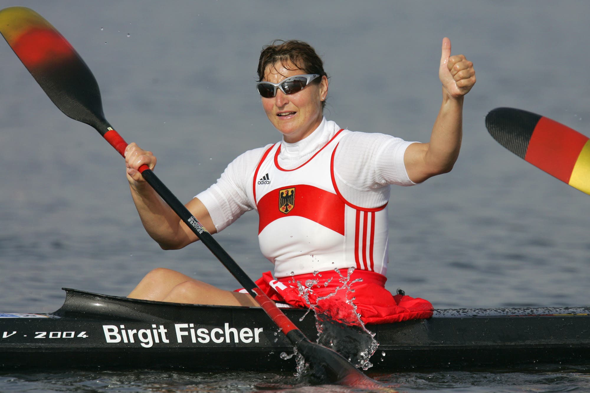 Germany's seven-time kayaking gold medalist Birgit Fischer celebrates after she and her teammates won the Women's K4 500 meter final to take the gold medal, during the kayak flatwater event at the 2004 Olympic Games in Schinias near Athens, Greece, Friday, Aug. 27, 2004. (AP)