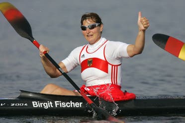 Germany's seven-time kayaking gold medalist Birgit Fischer celebrates after she and her teammates won the Women's K4 500 meter final to take the gold medal, during the kayak flatwater event at the 2004 Olympic Games in Schinias near Athens, Greece, Friday, Aug. 27, 2004. (AP)