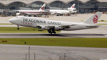 A Hong Kong-based Dragonair cargo plane lands at the Hong Kong airport July 23, 2002. (Reuters)