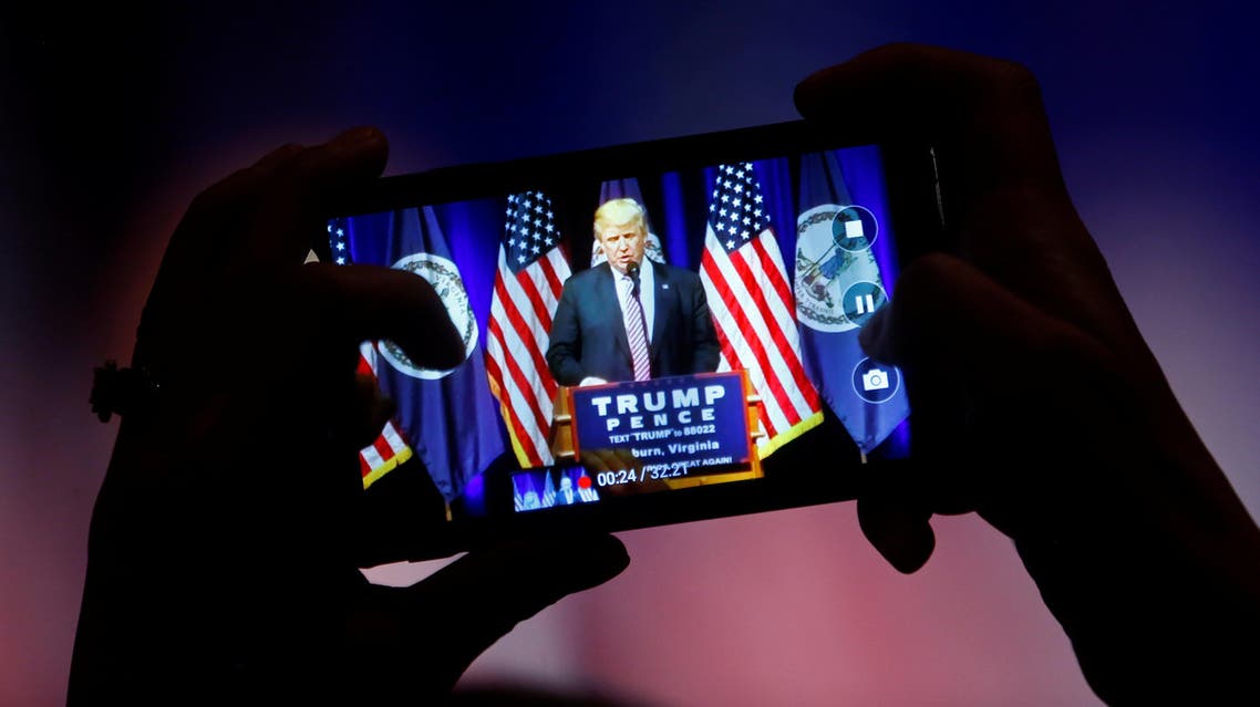 A supporter photographs Republican U.S. Presidential nominee Donald Trump during a campaign event at Briar Woods High School in Ashburn, Virginia, U.S., August 2, 2016. (Reuters)
