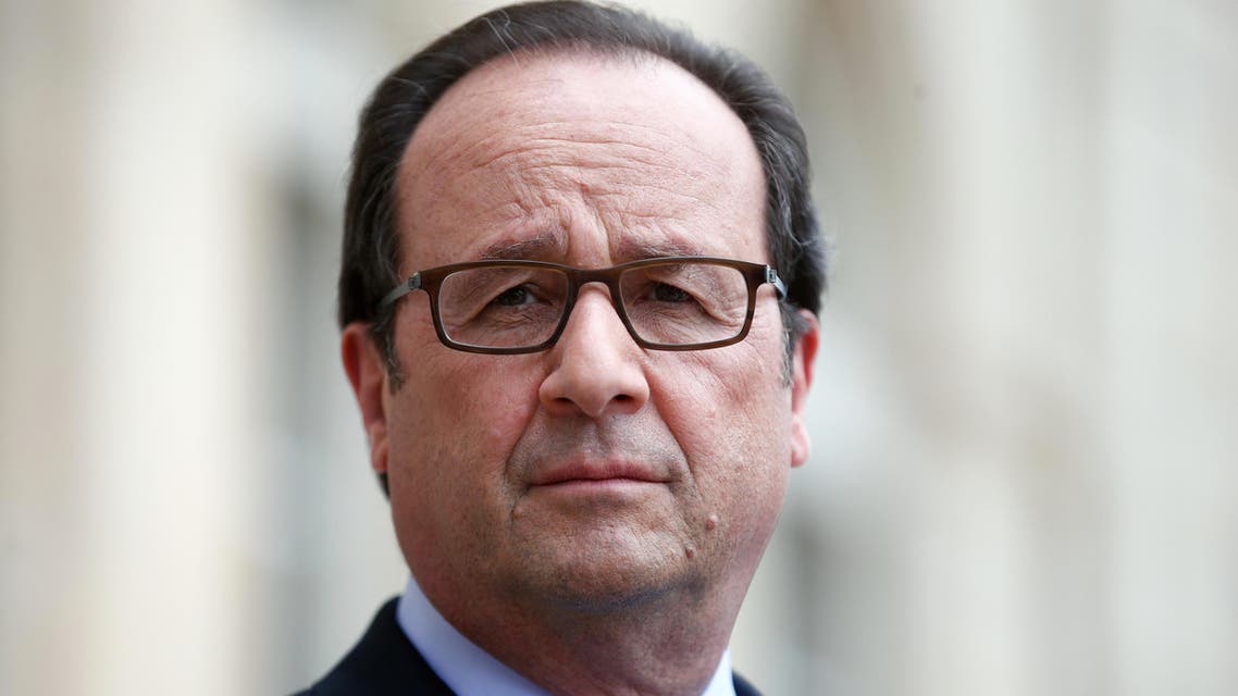 French President Francois Hollande visits an exhibition during a ceremony marking the first anniversary of the energy transition law, at the Elysee Palace, in Paris, on July 22, 2016. AFP