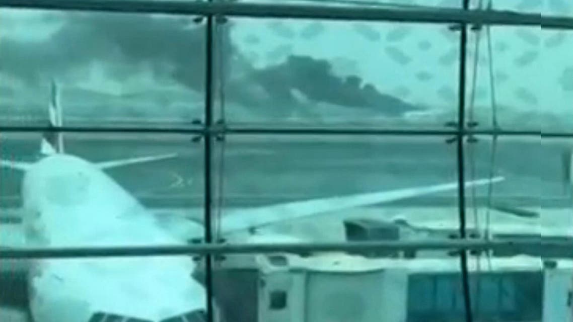 Still picture taken from an amateur video shows smoke after an Emirates Airline flight crash-landed at Dubai International Airport. (Reuters)
