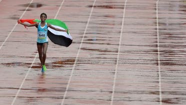 UAE's Betlhem Desalegn makes her victory lap on the fifth and the final day of Asian Athletics Championship 2013 in Pune on July 7, 2013. (AFP)