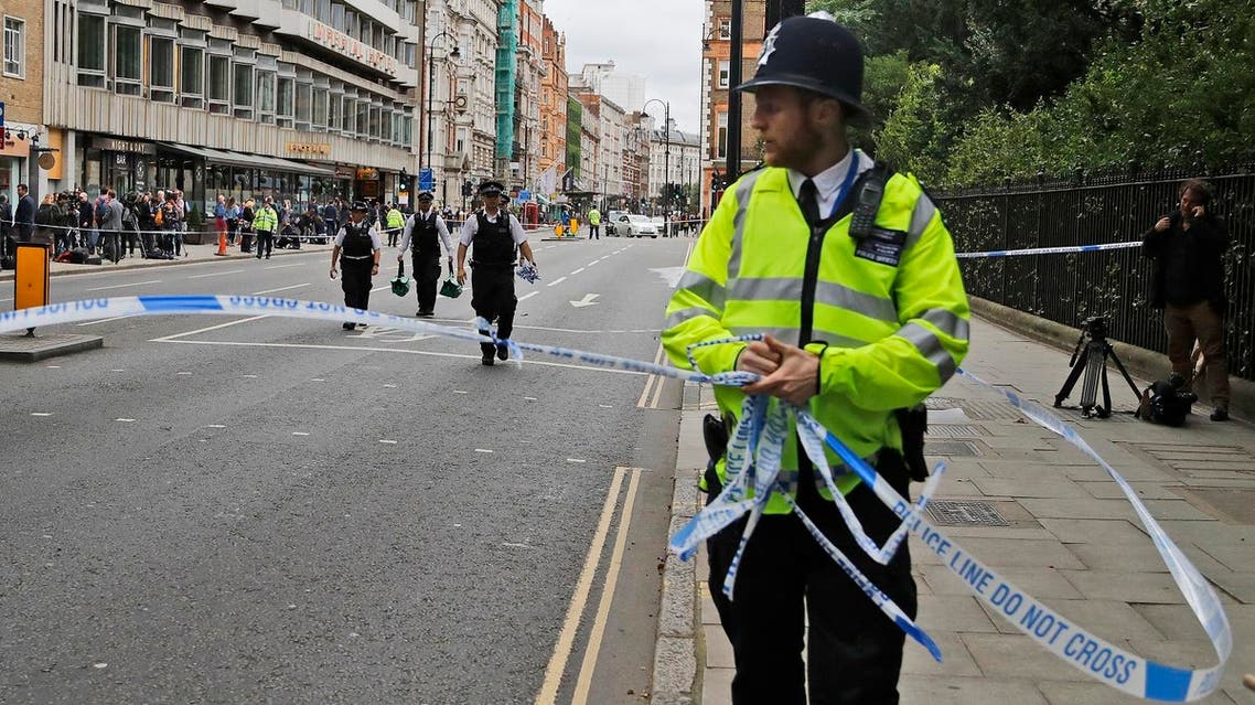 Police forces clear police tape off Russel Square in London, Thursday, Aug. 4, 2016. Terrorism is being examined as a potential motive for a knife rampage at Russell Square, central London, that left one woman dead and five others injured. (AP Photo/Frank Augstein)