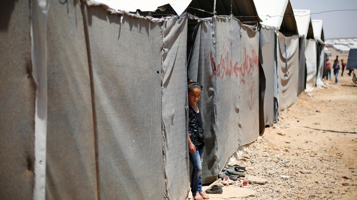 A Syrian refugee girl stands in front of her family residence at Azraq refugee camp near Al Azraq city, Jordan, June 27, 2016. REUTERS/
