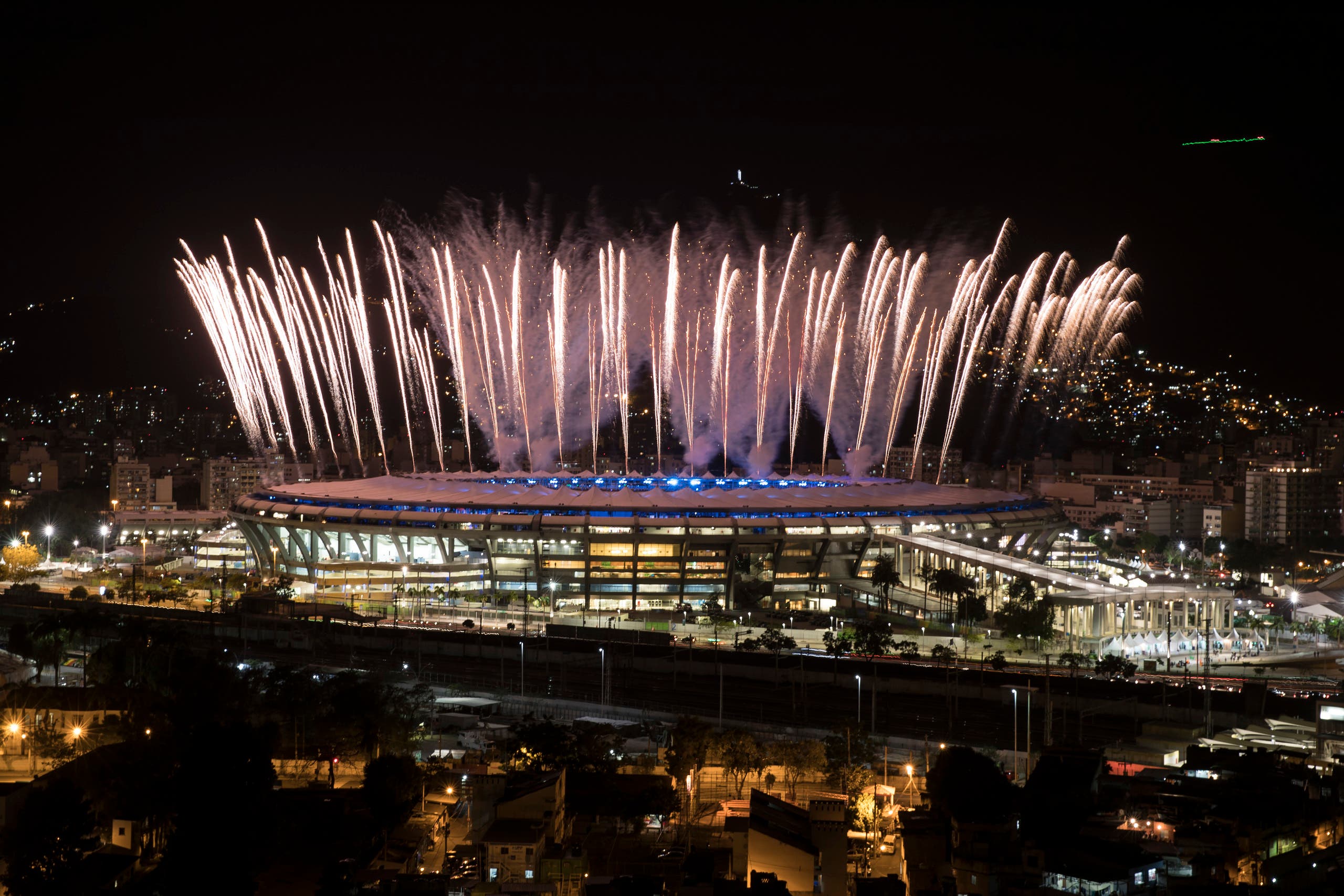 Fireworks explode above the Maracana stadium during the rehearsal of the opening ceremony of the Olympic Games in Rio de Janeiro, Brazil, Sunday, July 31, 2016. (AP