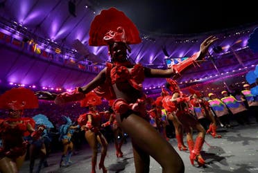 Performers take part in the opening ceremony. REUTERS