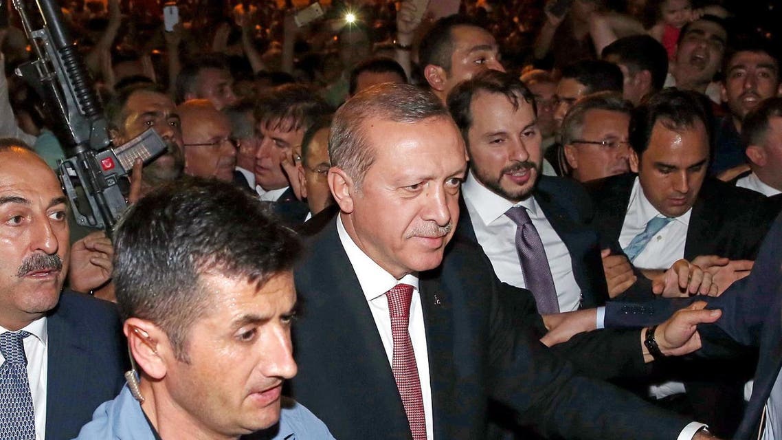 Turkey's President Recep Tayyip Erdogan, center, walks to greet people gathering outside of the Presidential Palace in Ankara, Turkey, Wednesday, Aug. 3. (Photo:AP)