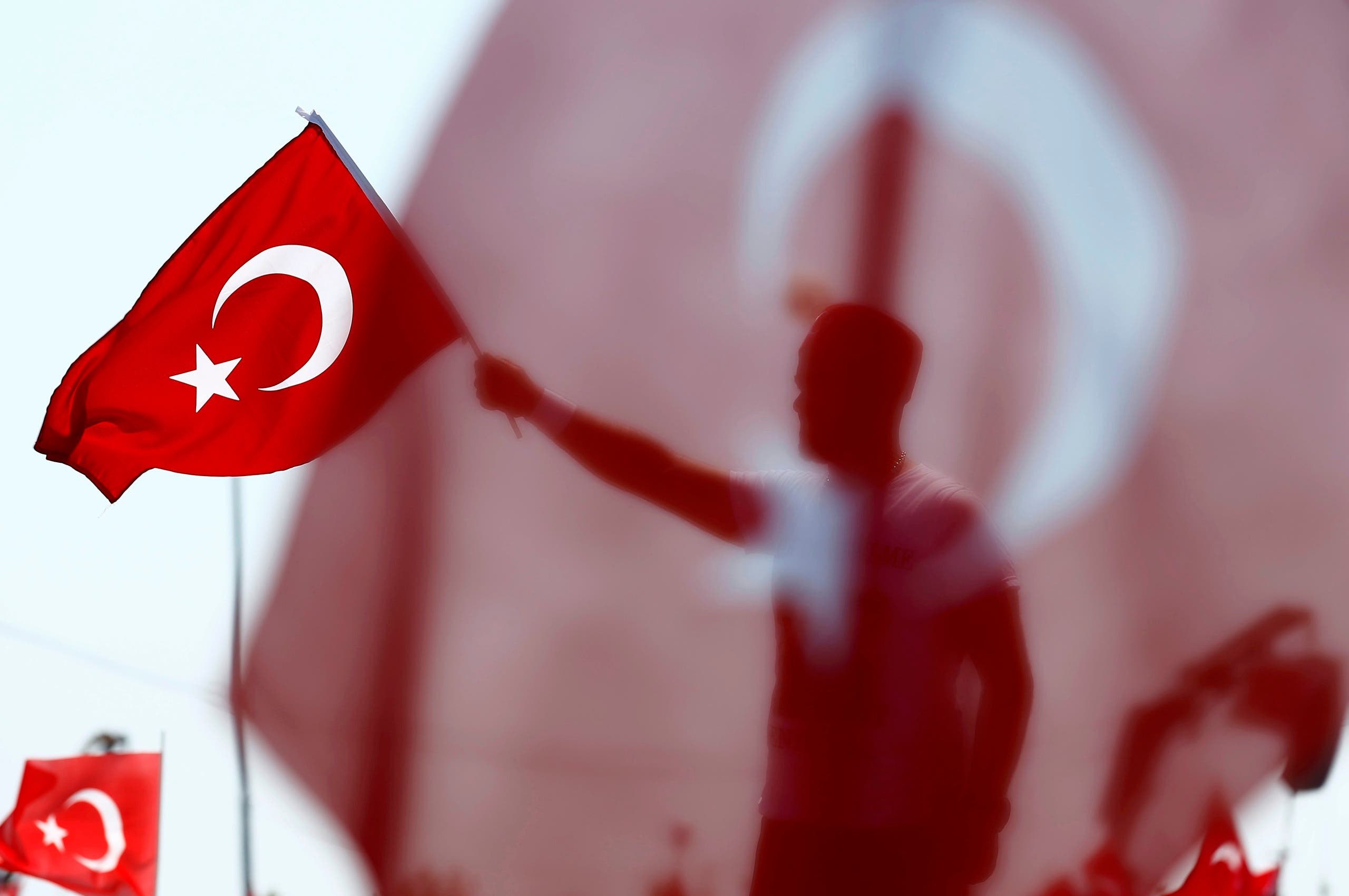 A man waves Turkey's national flag during the Democracy and Martyrs Rally in Istanbul. (Reuters)