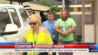 Australian man charged with planning terror attack following raids