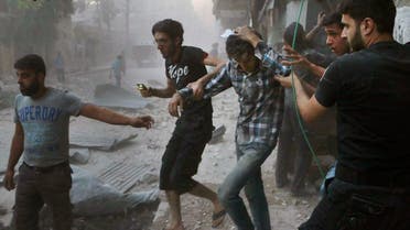 In this Sunday, July. 31, 2016 photo, provided by the Syrian anti-government activist group Aleppo Media Center (AMC), shows Syrians help an injured man, center, after airstrikes hit Aleppo, Syria (File Photo: Aleppo Media Center via AP)