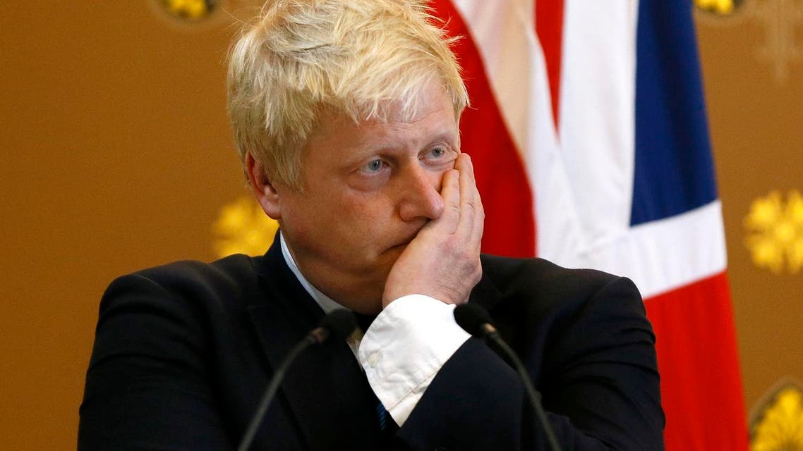 Britain's Foreign Secretary Boris Johnson listens as U.S. Secretary of State John Kerry speaks during a press conference at the Foreign Office in London, Tuesday, July 19, 2016. U.K. Foreign Secretary Boris Johnson refused Tuesday to apologize for the withering one-liners he's made about world leaders in the past but won the support of Britain's closest ally as the country navigates its difficult path out of the European Union. (AP Photo/Kirsty Wigglesworth, pool)