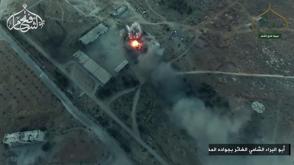 A still from drone footage by Al-Nusra Front showing smoke billowing from an artillery school south of Aleppo as Islamist rebels captured two military academies and a third military position – August 6, 2016. (AFP)