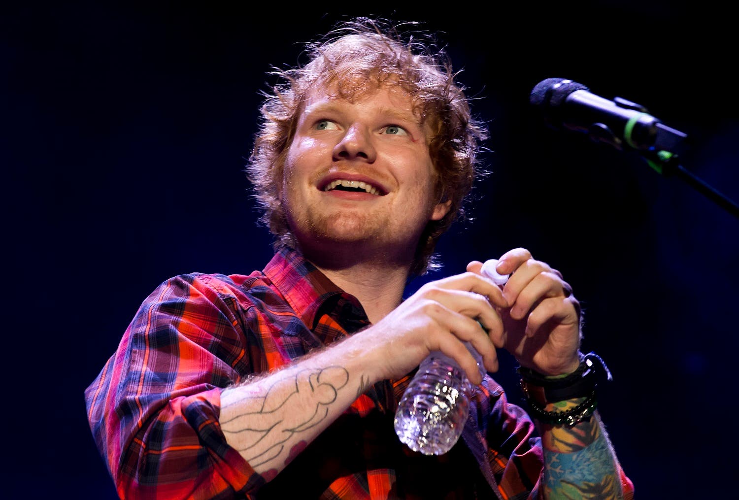 Ed Sheeran performing at a concert AP