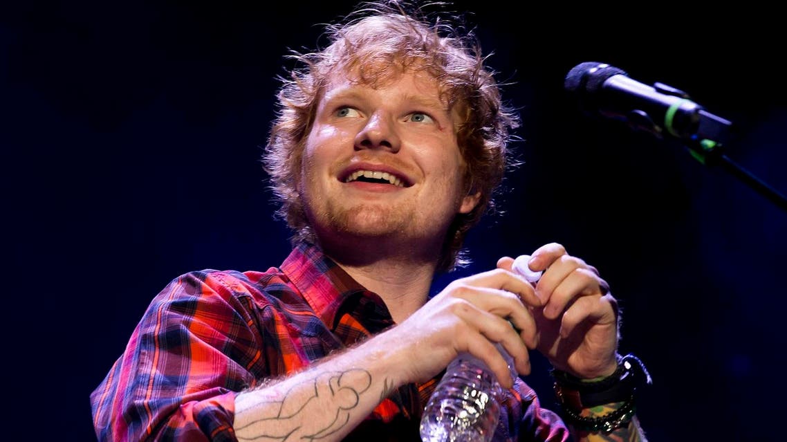 Ed Sheeran performing at a concert AP