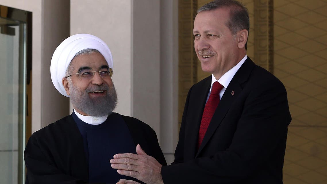 Turkey’s President Recep Tayyip Erdogan, right, and Iran’s President Hassan Rouhani shake hands during a welcome ceremony in Ankara, Turkey, on April 16, 2016. (AP)