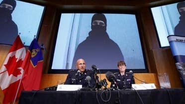 A video of Aaron Driver, a Canadian man killed by police on Wednesday who had indicated he planned to carry out an imminent rush-hour attack on a major Canadian city, is projected on a screen during a news conference with Royal Canadian Mounted Police (RCMP) Deputy Commissioner Mike Cabana (L) and Assistant Commissioner Jennifer Strachan in Ottawa, Ontario, Canada, August 11, 2016. reuters