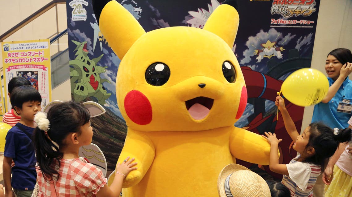 Pokemon character, is surrounded by children during a Pokemon festival in Tokyo. (File Photo:AP)