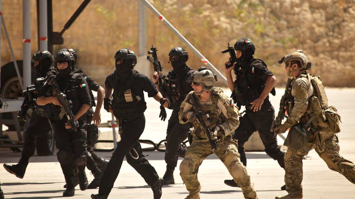 In this Thursday, June 20, 2013 file photo, special operations forces from Jordan and the U.S. conduct a combined demonstration with commandos from Iraq, unseen, as part of Eager Lion multinational military maneuvers, at the King Abdullah Special Operations Training Center (KASOTC) in Amman, Jordan. ap
