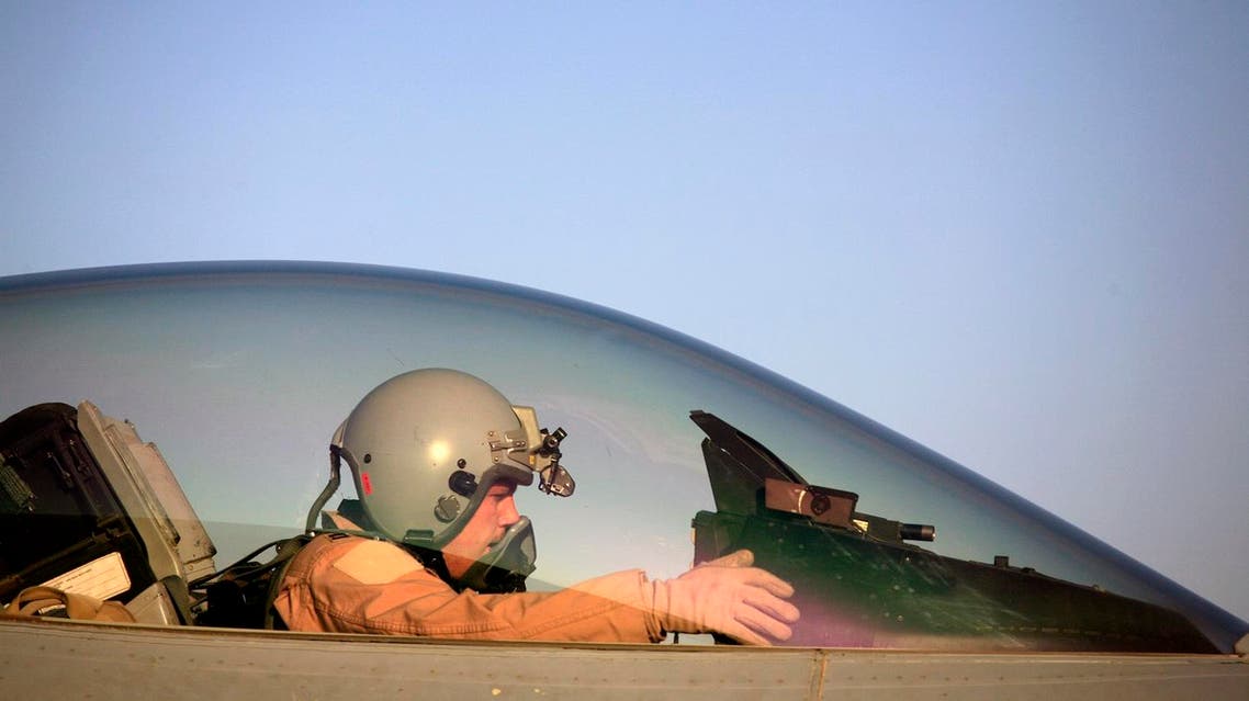 In this Thursday, June 21, 2007 file photo, U.S. Air Force Capt. Shaun Germain, 26, from Lindstrom, Minn. prepares to pilot his F-16 Falcon aircraft at Balad Air Base, 50 miles north of Baghdad, Iraq. (AP)