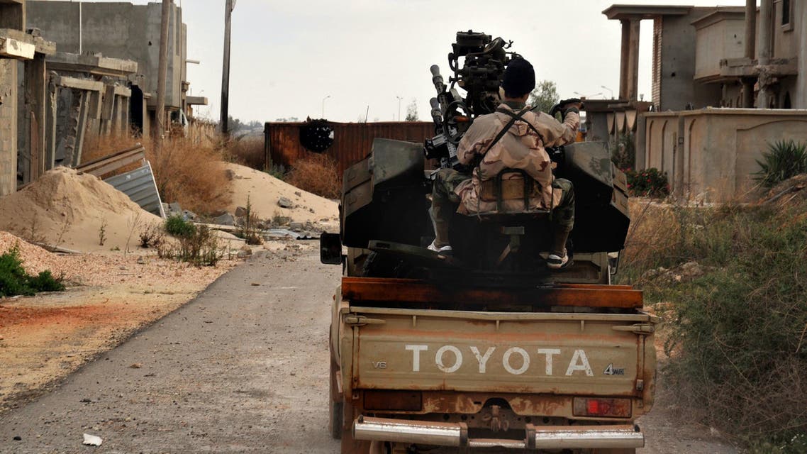 In this March 7, 2016 file photo, a man loyal to the Libyan armed forces prepares himself for clashes with Islamic State group militants west of Benghazi, Libya. AP