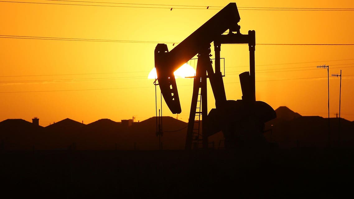 A pumpjack sits on the outskirts of town at dawn in the Permian Basin oil field on January 21, 2016 in the oil town of Midland, Texas. (AFP)
