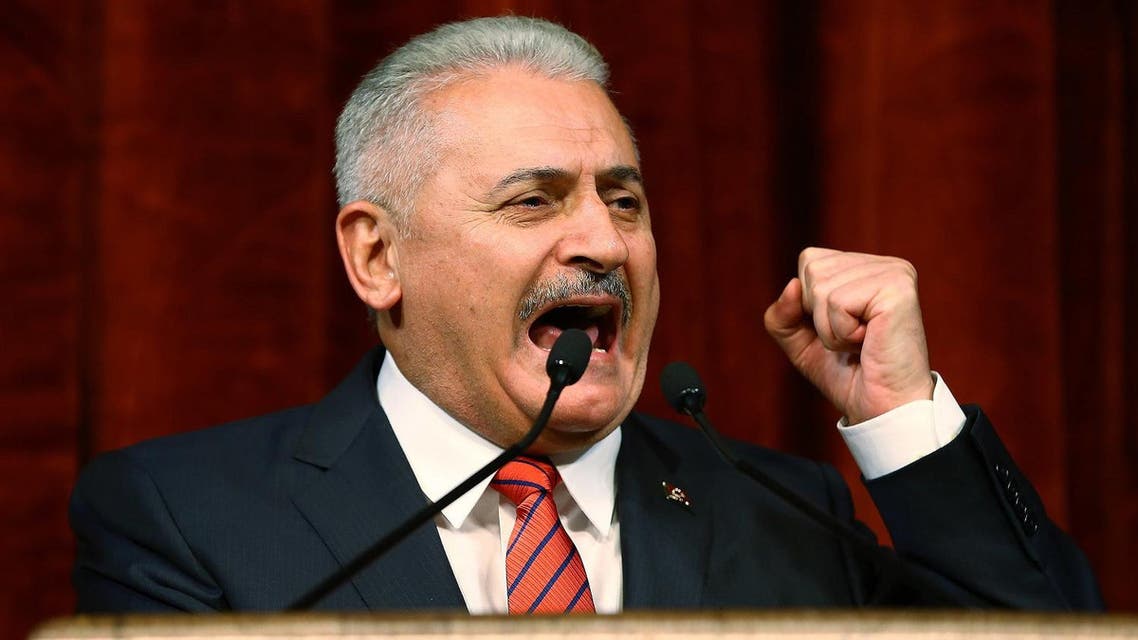 Turkish Prime Minister Binali Yildirim delivers a speech commenting on those killed and wounded during a failed July 15 military coup, in Ankara, Turkey, late Friday, July 29, 2016. The government crackdown in the coup's aftermath has strained Turkey's ties with key allies including the United States. (AP Photo/Kayhan Ozer Presidential Press Service, via AP Pool)