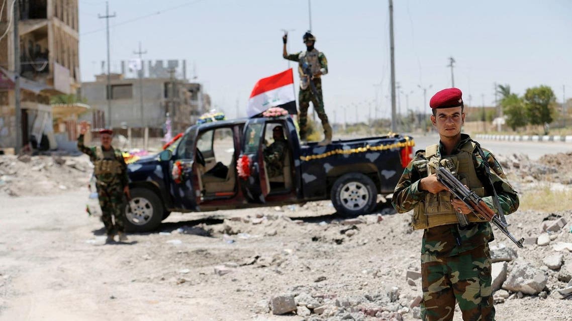 Vehicles of the Iraqi security forces move toward Falluja on the outskirts of the city in Iraq, June 10, 2016. REUTERS
