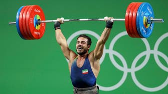 Iran breaks world record, wins gold in Olympics weightlifting
