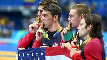 Team USA pose with their gold medals. REUTERS