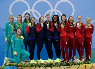  Team U.S., gold, center, and Denmark pose together on the podium after the women's 4 x100 meter medley relay during the swimming competitions at the 2016 Summer Olympics, Saturday, Aug. 13, 2016, in Rio de Janeiro, Brazil. (AP)