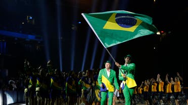 Brazil’s Thiago Pereira carries his nation's flag during the opening ceremony of the 2015 Pan Am Games in Toronto, Friday, July 10, 2015. (File Photo:AP)