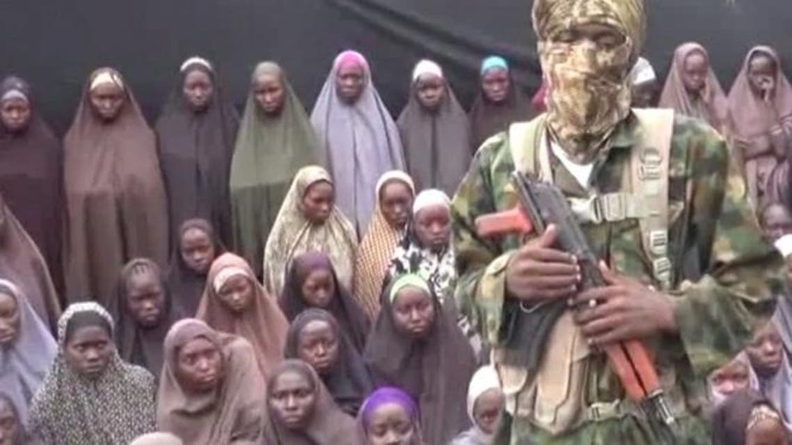 Boko haram seen with the kidnapped chibok girls. (File Photo:Reuters)