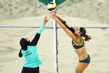 An iconic hijab photo shows Doaa Elghobashy (EGY) of Egypt and Kira Walkenhorst (GER) of Germany compete in Olympic beach volleyball. (File photo: Reuters)
