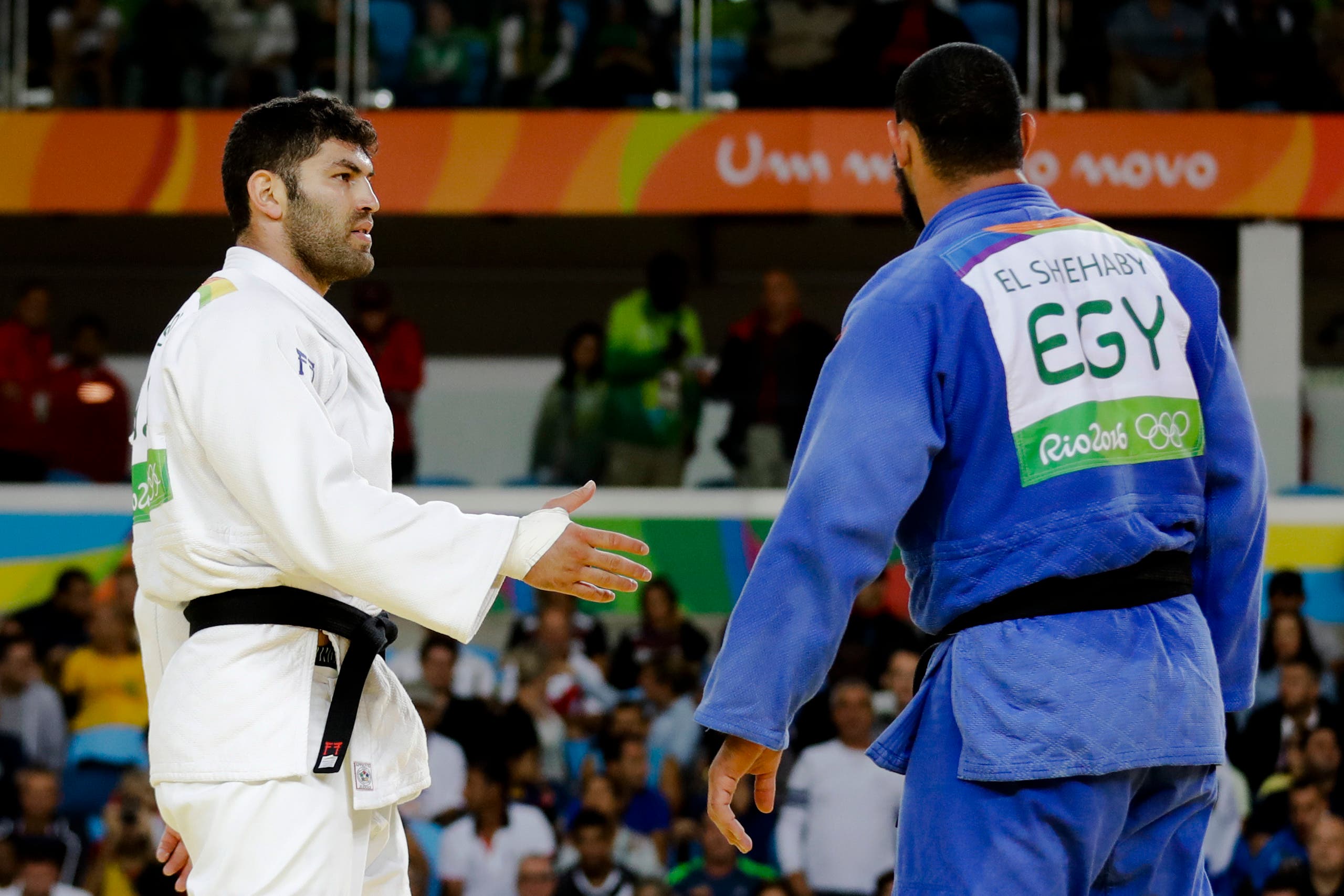 Egypt's Islam El Shehaby, blue, declines to shake hands with Israel's Or Sasson, white, after losing during the men's over 100-kg judo competition at the 2016 Summer Olympics in Rio de Janeiro, Brazil, Friday, Aug. 12, 2016. (AP)