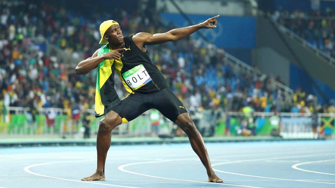 Usain Bolt (JAM) of Jamaica celebrates winning the gold. REUTER